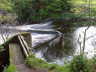 The old weir, now badly repaired
